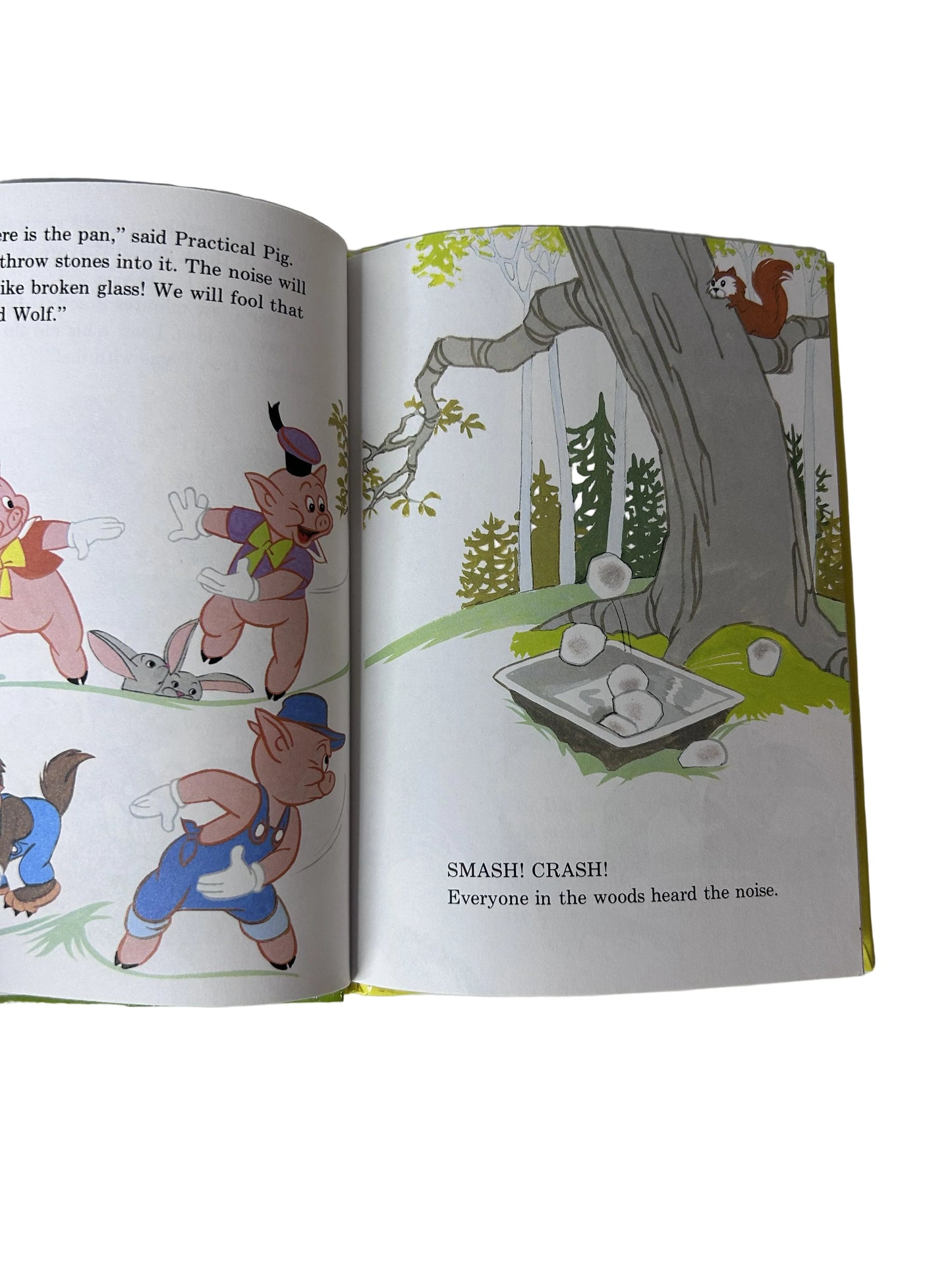 Walt Disney's The Big Bad Wolf and Li'l Wolf - interior spread showing Practical Pig, Li'l Wolf, and the pigs throwing stones into a pan to fool the Big Bad Wolf