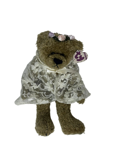 Eve bear plush in seated side view