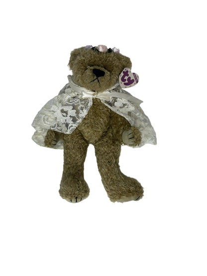 Front view of Eve bear wearing floral lace cape